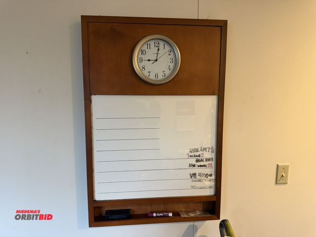 Lot 1-18941 - (1) Howard Miller custom built wall clock cabinet with white board, 25" wide x 37.5" tall.