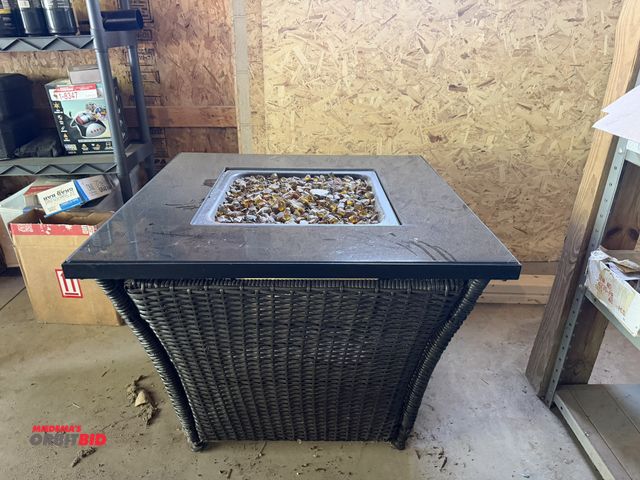 Lot 1-8381 - (1) 32" width x 24" height x 32" depth wicker base table with black lacquer glass top, and stone/gla...