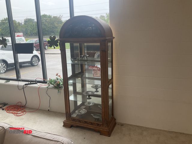 Lot 1-17159 - Oak curio cabinet. Light does not work. 84” tall by 34” wide by 16” deep.