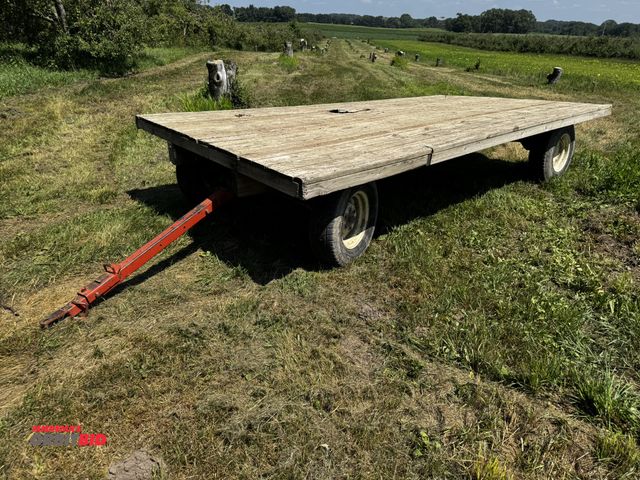 Lot 1-7011 - (1) 16' x 99.5" wide flat bed hay wagon, 245/75R16 tires, decking has 1 hole, winning bidder respons...