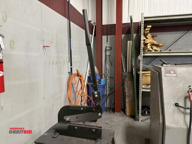 Lot 1-19230 - (1) approx. 12" capacity heavy duty cutting tool with 28" long handle, mounted to a 23" width x 29.5...