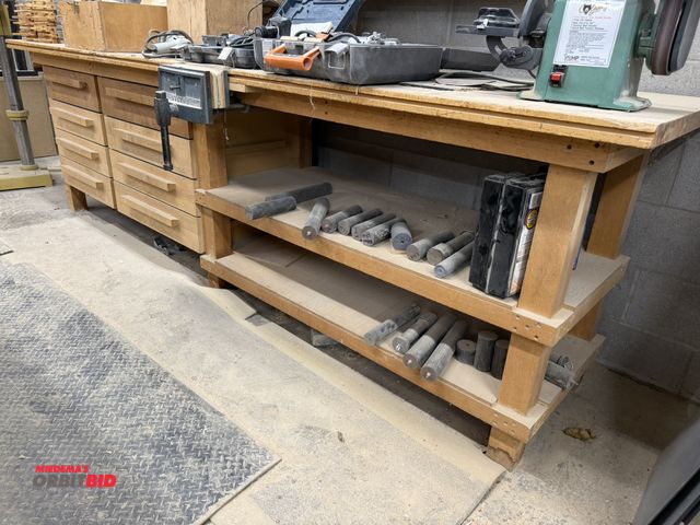 Lot 1-16587 - (1) custom built 12-drawer wood table, 10' length x 30" depth, with Wilton 10" table clamp, includes...