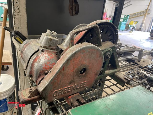 Lot 1-6233 - (1) Greenlee electric tugger reel, 120V, condition unknown, includes a box of assorted parts.