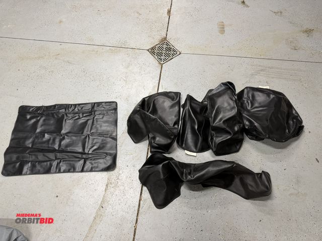 Lot 1-8251 - Lot of assorted Harley fender covers and gas tank covers with cloth bag.