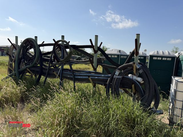 Lot 1-9555 - Large lot of assorted size discharge hose with stand, various lengths and diameters, stand is welded...