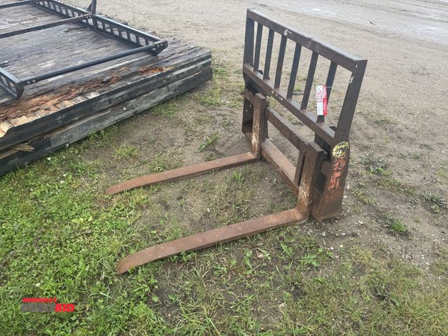 Lot 1-19723 - (1) set of skid steer fork attachments, 46" x 3 3/4" wide forks, forks are bent at tip.