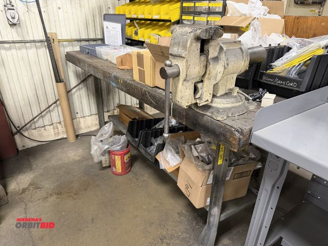 Lot 1-15317 - (1) 72" steel framed, wood top work bench with a 5" bench mounted vise, does not include contents, t...