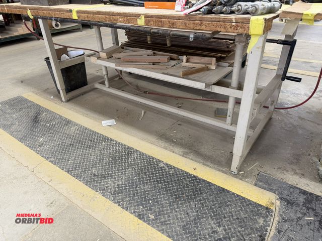 Lot 1-16167 - (1) 70" width x 32" height x 32" depth crank style, adjustable height work bench with lower shelf an...