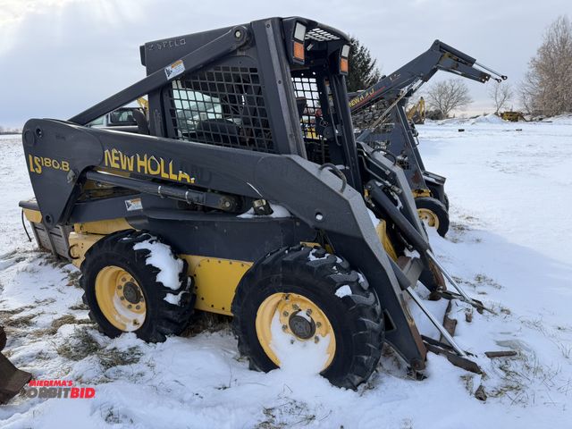 Lot 1-11520 - (1) New Holland LS180B skid steer, Product ID #N5M415797, 12-16.5 tires, missing rear door, missing ...