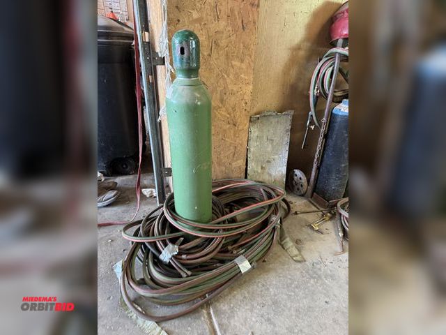 Lot 1-14200 - Lot of assorted torch hoses, and (1) 28" tall oxygen gas bottle.