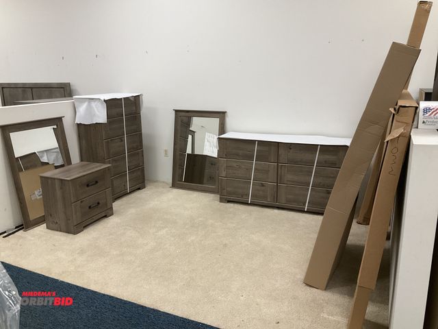 Lot 1-17263 - Bedroom set including; dressers with hardware unassembled, mirrors, nightstand, and matching bed fra...