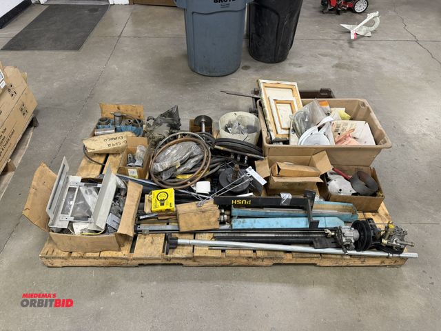 Lot 1-15295 - Large skid of assorted machine parts, includes pulleys, springs, air cylinders, screws, motors, brac...