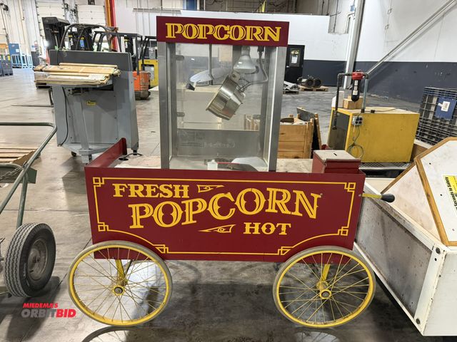 Lot 1-5624 - (1) Cretors Nugget Gold Rush T-2000 popcorn machine with 4' long decorative cart with 20" diameter s...