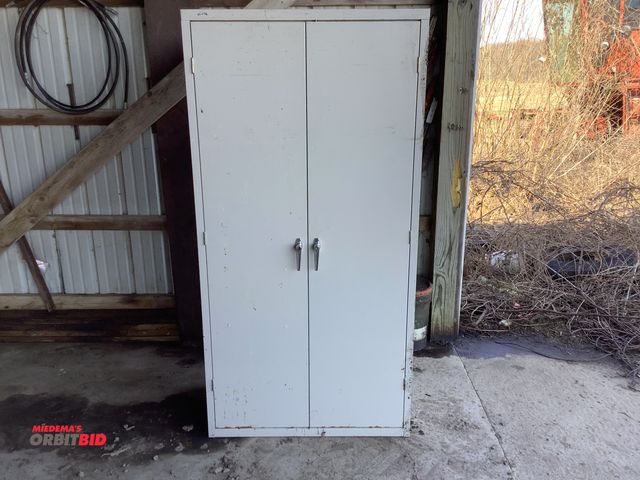Lot 1-19066 - Hon 2 door cabinet, 36” wide by 18” deep by 72” tall.