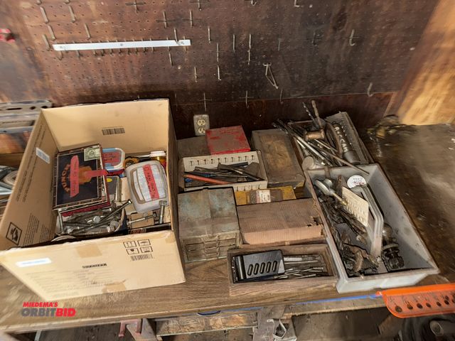 Lot 1-12119 - Lot of assorted drill bits, chisels, nuts, bolts, washers, small parts bin, and more.