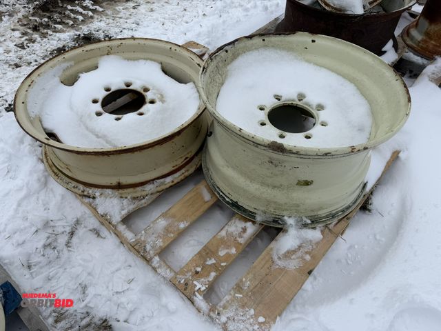 Lot 1-11679 - (1) 8-bolt tire rim, approx. 23 3/4" diameter, 8" from inside of bead to inside of bead, and (1) 8-b...