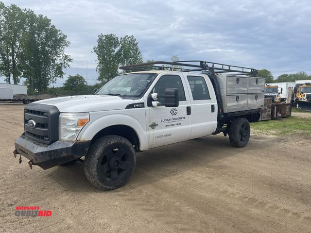 Lot 1-19700 - 2011 Ford F350 Super Duty King Ranch pickup truck, crew cab, long bed with Buyers Diamond Plate side...