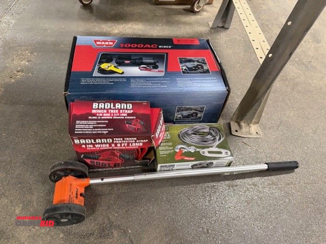 Lot 1-16940 - (1) Badland winch tree strap, (1) Badland 50', 3/16" ATV rope and fairlead set, and (1) Warn winch c...