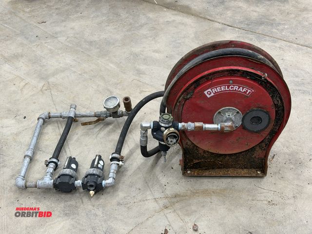 Lot 1-1391 - (1) Reelcraft heavy duty, retractable air hose reel with oil water separator attached, unit does not...