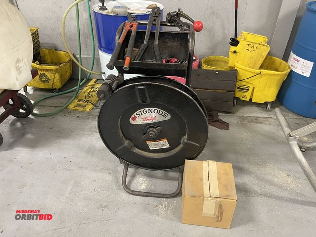 Lot 1-19366 - (1) Signode, model DF15, metal banding dispenser with 1/2" metal banding tools, and box of clips.