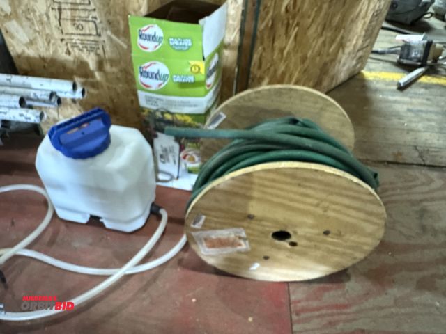Lot 1-4487 - (1) spool of garden hose, (1) Round-Up Control 2 gallon Multi-Sprayer, and a Switch Tank poly tank.