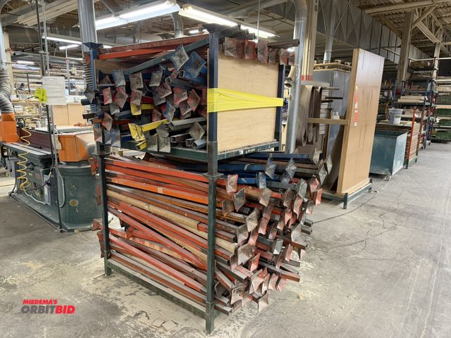 Lot 1-16481 - (2) stackable racks, 48" x 35.5" x 9" tall, filled with assorted adjustable height legs.