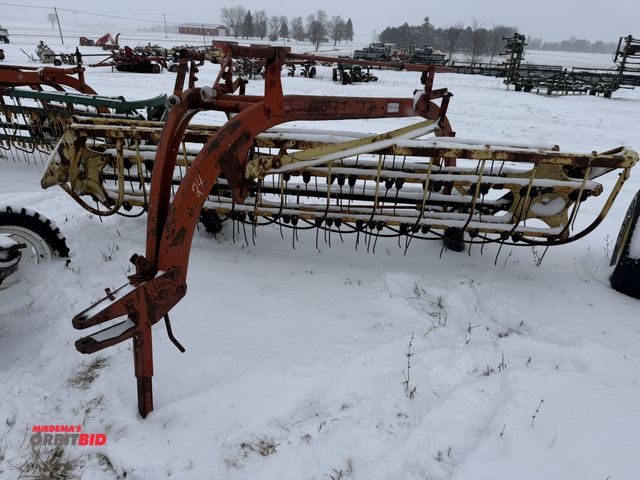 Lot 1-10404 - (1) New Holland 9' hay rake, pin style hitch, ground driven, some teeth are missing and will need to...