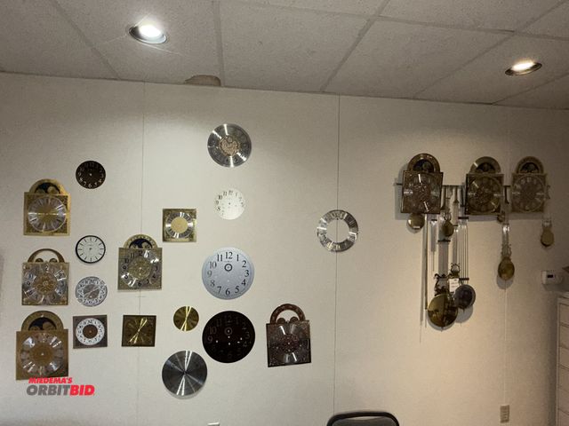 Lot 1-18934 - Contents of Howard Miller clock faces, pendulums, that are mounted on walls, winning bidder responsi...