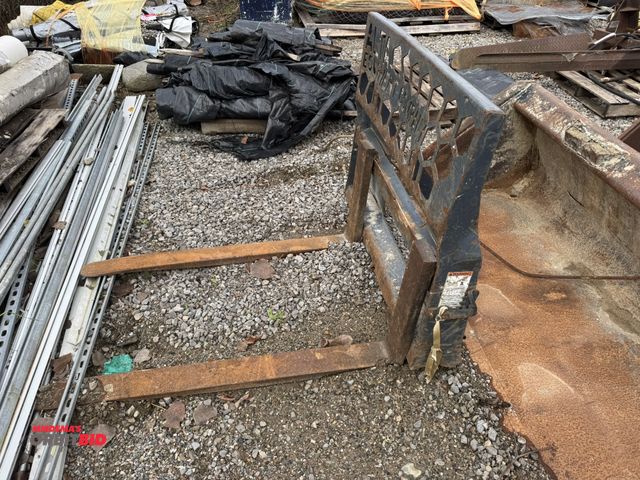 Lot 1-16038 - (1) Virnig fork attachment for a skid steer with 46" wide carriage (carriage is completely damaged a...