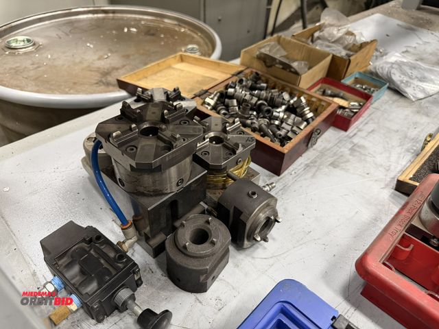 Lot 1-15417 - Lot of assorted Aurora air chucks, fittings, parts, braces, connectors, and more.