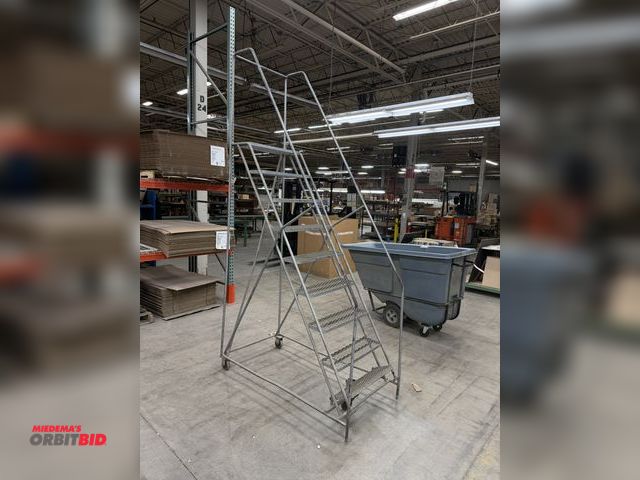 Lot 1-17464 - (1) 9-step rolling safety warehouse ladder.