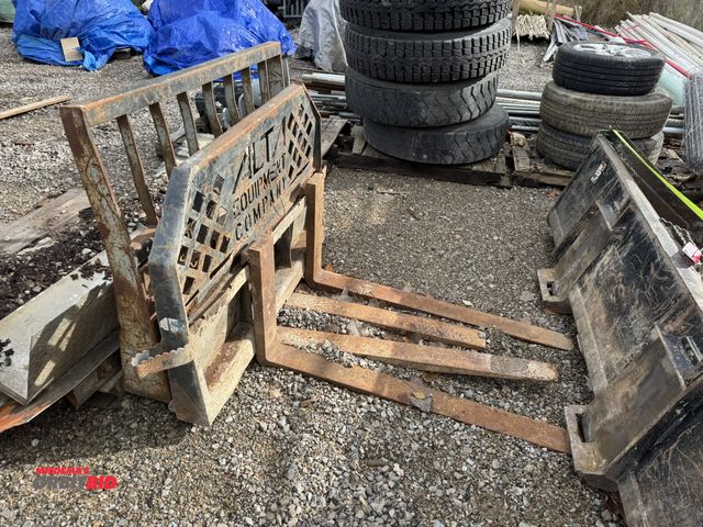 Lot 1-16041 - Lot of (2) fork attachments for skid steers, 45" wide carriages and 4" x 48" forks, 1 fork is cut of...