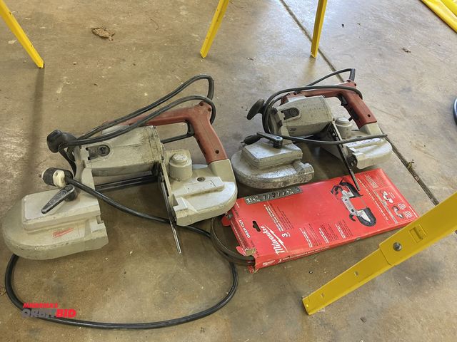 Lot 1-6126 - Lot of (2) Milwaukee heavy duty band saws, both in working condition, includes partial pack of blade...