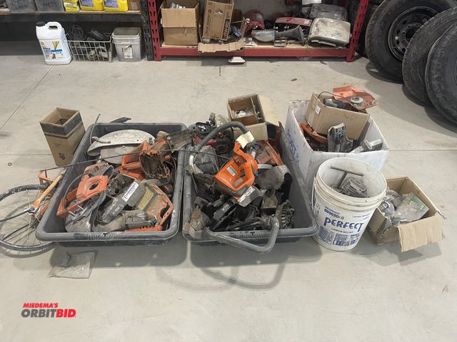 Lot 1-18772 - Large lot of Husqvarna saw parts, motors, housings, filters, and cranks.
