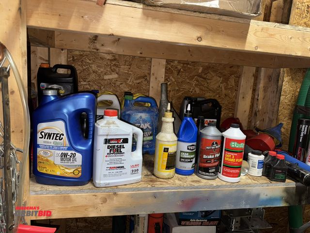 Lot 1-4560 - Contents of 2 shelves, includes assorted automotive items, jumper cables, 2" ratchet straps, snow sc...