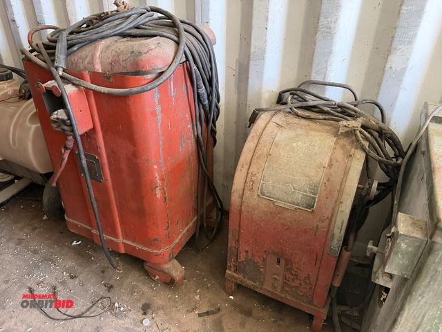 Lot 1-2973 - Lot of (2) heavy duty welders, may be for parts or repair, no visible ID tags, includes leads.