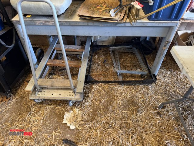 Lot 1-8516 - (1) 60" steel table, includes (3) rolling steel carts.