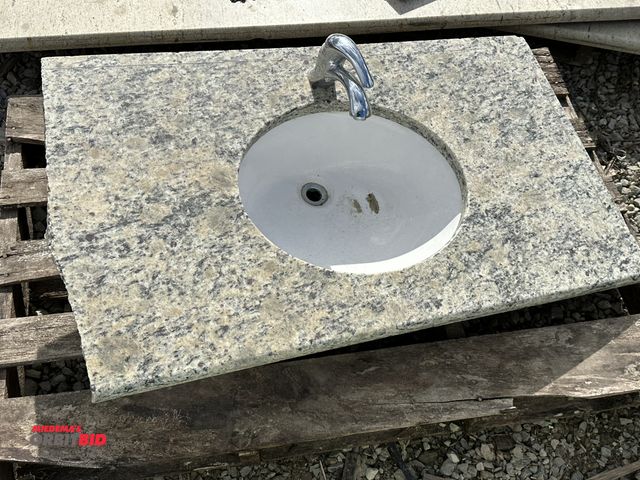 Lot 1-15847 - (1) granite undermount vanity top, 39" long x 22.5" deep, 1 part is cut, includes faucet and sink.