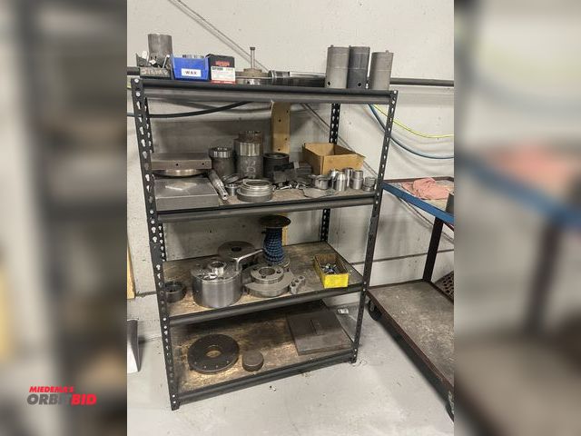 Lot 1-19282 - (1) metal shelf with assorted machining items, includes 8" face plate, flexible coolant hose, cap he...