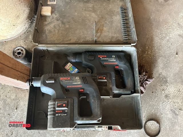 Lot 1-14183 - Lot of (2) Bosch, 24V "The Annihilator", model 11225VSR, hammer drills, (2) 24V batteries, and (2) c...