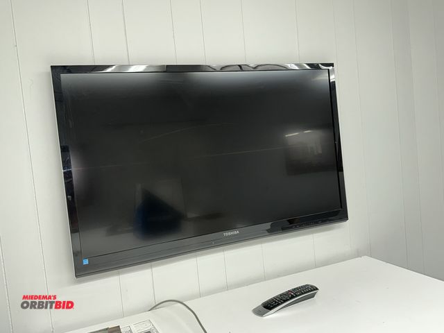 Lot 1-17806 - (1) Toshiba (model unknown) 42" flat screen TV, in working condition with remote, unit is mounted to...