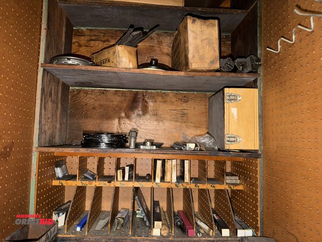 Lot 1-11055 - Entire contents of shelving in cabinet, includes various rings, Sunnen hone tooling, honing stones, ...