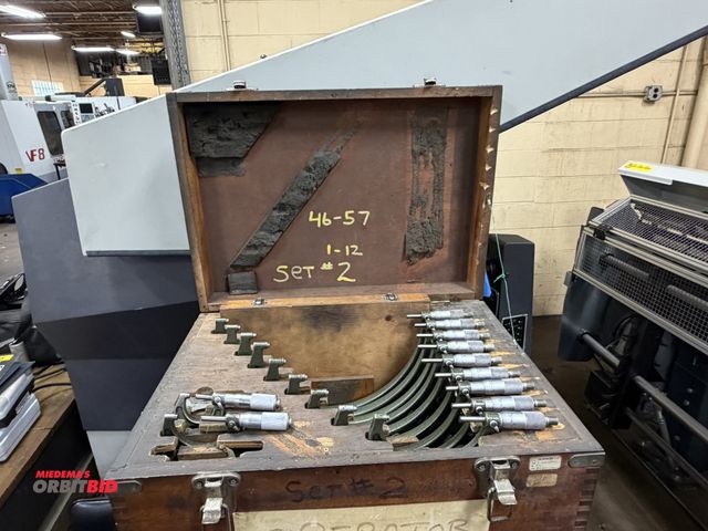 Lot 1-12446 - (1) set of micrometers, sizes 1-2", up to 11-12" with wood case (missing 0-1" caliper).