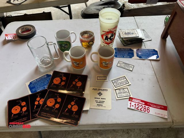 Lot 1-12286 - (1) Assorted Allis-Chalmers items including cups, stickers