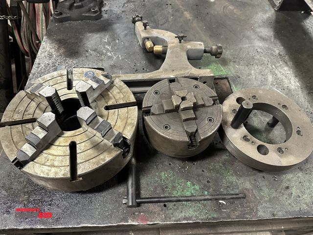 Lot 1-14428 - (1) 12" 4-jaw chuck, (1) 8" 4-jaw chuck, (1) 10" diameter adapter, and (1) steady rest