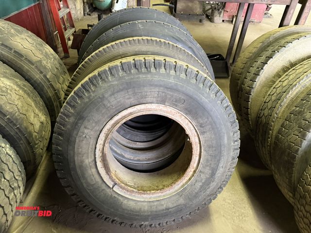 Lot 1-18183 - Lot of (3) various size 285/75R 245, and (1) size 10.00-20 tires with rings.
