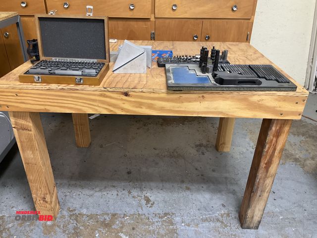 Lot 1-11991 - 1 47” width x 31” height x 32” depth wood table with contents including (1) set of Fowler QMP-CM-000...