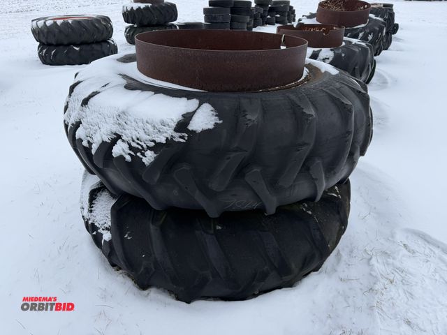 Lot 1-11637 - (1) set of used clamp on duals with 18.4-34 tires, tires are cracked and weather checked.