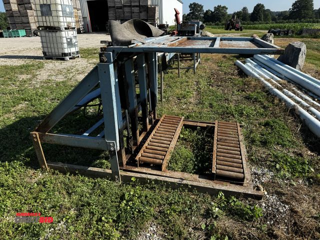 Lot 1-6934 - (1) hydraulic bin dumper with a 1 HP, single phase, 120V, motor, 48" rollers, winning bidder respons...