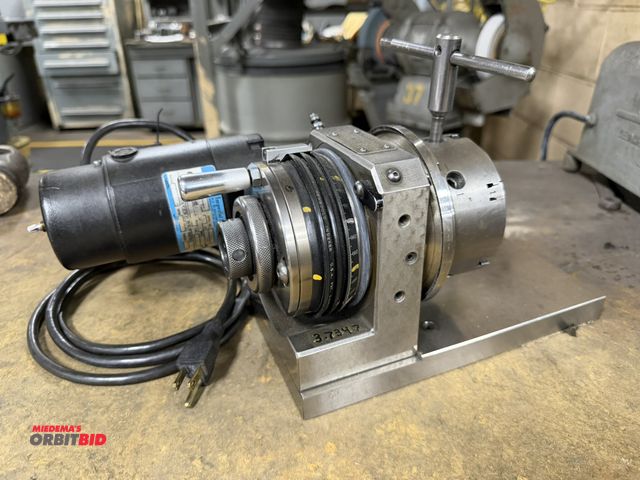 Lot 1-11049 - (1) New Bould Corporation, #202, motorized grinding chuck with 4" 6-jaw chuck, and 115V, single phas...